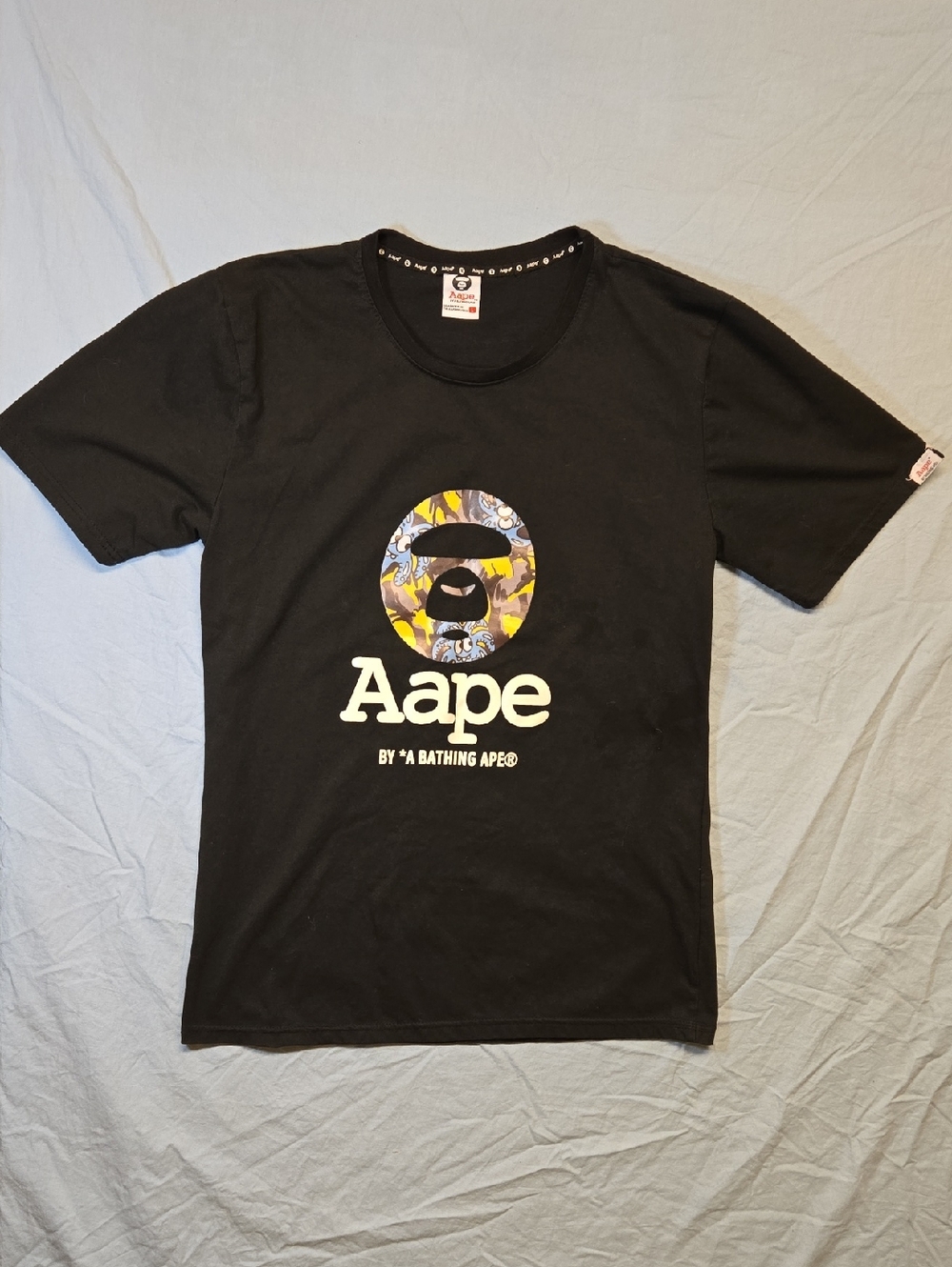 Aape by A Bathing Ape Black Logo T-Shirt with Yellow/Blue Camo Ape Head